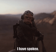 a monkey with goggles and headphones says i have spoken